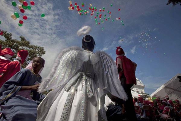Children wear costumes as they partake in a Christmas pageant at the presidential palace on Christmas Eve in Port-au-Prince, Thursday.