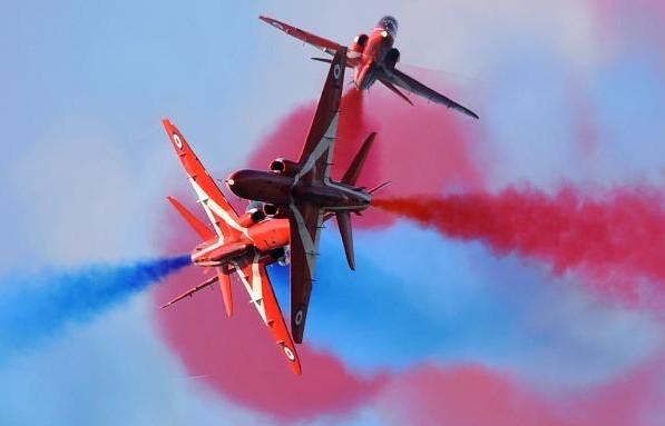 The British Royal Air Force Aerobatic Team ��Red Arrows��perform in the skies of Rivolto army base during an air show on Sept. 12, 2010.(Xinhua/AFPPhoto)