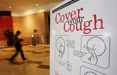A&nbsp;government&nbsp;sponsored&nbsp;poster&nbsp;warning&nbsp;of&nbsp;the&nbsp;spread&nbsp;of&nbsp;the&nbsp;flu&nbsp;is&nbsp;posted&nbsp;in&nbsp;an&nbsp;office&nbsp;building&nbsp;in&nbsp;New&nbsp;York.(AFP/Getty&nbsp;Images/Mario&nbsp;Tama)