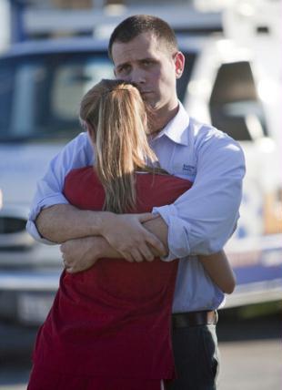 Daniel&nbsp;Clark&nbsp;(R)&nbsp;and&nbsp;Rachel&nbsp;Clark&nbsp;embrace&nbsp;after&nbsp;a&nbsp;press&nbsp;conference&nbsp;at&nbsp;Ft.&nbsp;Hood&nbsp;on&nbsp;November&nbsp;5,&nbsp;2009&nbsp;in&nbsp;Killeen,&nbsp;Texas.&nbsp;[CFP]