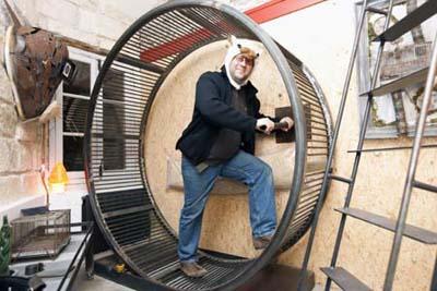 French&nbsp;architect&nbsp;Frederic&nbsp;Tabary&nbsp;poses&nbsp;inside&nbsp;the&nbsp;"Hamster's&nbsp;Villa",&nbsp;imagined&nbsp;and&nbsp;conceived&nbsp;by&nbsp;Tabary&nbsp;together&nbsp;with&nbsp;architect&nbsp;Yann&nbsp;Falquerho,&nbsp;during&nbsp;an&nbsp;interview&nbsp;with&nbsp;Reuters&nbsp;in&nbsp;Nantes,&nbsp;western&nbsp;France,&nbsp;November&nbsp;8,&nbsp;2009.&nbsp;For&nbsp;99&nbsp;euros&nbsp;($148)&nbsp;a&nbsp;night,&nbsp;guests&nbsp;can&nbsp;sleep&nbsp;in&nbsp;the&nbsp;18th&nbsp;century&nbsp;caretaker's&nbsp;room&nbsp;designed&nbsp;to&nbsp;give&nbsp;the&nbsp;impression&nbsp;of&nbsp;living&nbsp;in&nbsp;a&nbsp;hamster's&nbsp;cage,&nbsp;complete&nbsp;with&nbsp;a&nbsp;2-metre&nbsp;wheel&nbsp;to&nbsp;run&nbsp;in.&nbsp;Picture&nbsp;taken&nbsp;November&nbsp;8,&nbsp;2009.(Xinhua/Reuters&nbsp;Photo)