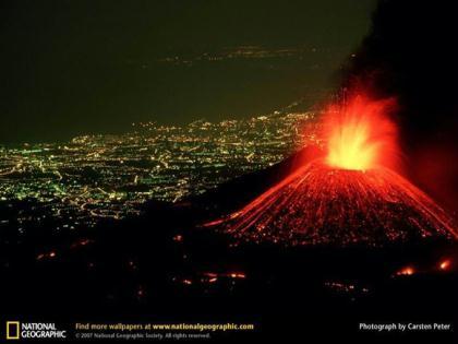 Perched&nbsp;above&nbsp;the&nbsp;lighted&nbsp;city&nbsp;of&nbsp;Catania,&nbsp;Italy,&nbsp;Mount&nbsp;Etna&nbsp;hurls&nbsp;a&nbsp;fountain&nbsp;of&nbsp;fire&nbsp;skyward&nbsp;as&nbsp;rivers&nbsp;of&nbsp;lava&nbsp;spill&nbsp;down&nbsp;its&nbsp;flanks.&nbsp;In&nbsp;spite&nbsp;of&nbsp;its&nbsp;dazzling&nbsp;displays,&nbsp;Mount&nbsp;Etna&nbsp;is&nbsp;a&nbsp;relatively&nbsp;safe&nbsp;volcano&nbsp;with&nbsp;rare,&nbsp;compact&nbsp;eruptions&nbsp;and&nbsp;slow-flowing&nbsp;lava&nbsp;that&nbsp;gives&nbsp;people&nbsp;a&nbsp;chance&nbsp;to&nbsp;escape.