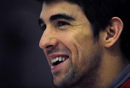 Michael Phelps of the U.S. swimming team smiles during a news conference at the Manchester Aquatics Centre in northern England December 17, 2009. The U.S. will take on Europe in a Duel in the Pool event in Manchester on Friday and Saturday. (Xinhua/Reuters File Photo)