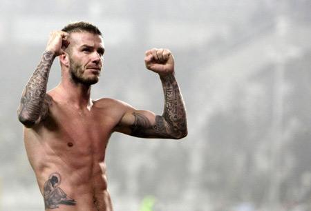 AC Milan David Beckham celebrates at the end of the match against Juventus during their Serie A soccer match at Olympic stadium in Turin, January 10, 2010. AC Milan won 3-0.[Photo/Agencies]