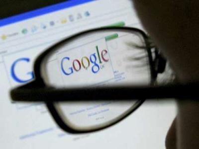 A Google search page is seen through the spectacles of a computer user in Leicester, central England July 20, 2007. (Xinhua/Reuters Photo)
