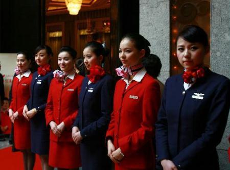Stewardess&nbsp;of&nbsp;both&nbsp;China&nbsp;Eastern&nbsp;Airlines&nbsp;and&nbsp;Shanghai&nbsp;Airlines&nbsp;show&nbsp;up&nbsp;at&nbsp;a&nbsp;joint&nbsp;meeting&nbsp;by&nbsp;the&nbsp;two&nbsp;airlines&nbsp;in&nbsp;Shanghai,&nbsp;east&nbsp;China,&nbsp;on&nbsp;Feb.&nbsp;8,&nbsp;2010,&nbsp;during&nbsp;which&nbsp;the&nbsp;two&nbsp;Chinese&nbsp;air&nbsp;companies&nbsp;announced&nbsp;their&nbsp;successful&nbsp;merger.&nbsp;(Xinhua/Xia&nbsp;Benjian)