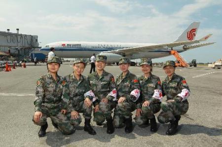 Six&nbsp;female&nbsp;members&nbsp;of&nbsp;the&nbsp;Chinese&nbsp;medical&nbsp;team&nbsp;pose&nbsp;for&nbsp;a&nbsp;group&nbsp;photo&nbsp;before&nbsp;leaving&nbsp;at&nbsp;the&nbsp;international&nbsp;airport&nbsp;in&nbsp;Port-au-Prince,&nbsp;capital&nbsp;of&nbsp;Haiti,&nbsp;Feb.&nbsp;8,&nbsp;2010.&nbsp;The&nbsp;Chinese&nbsp;medical&nbsp;team&nbsp;Monday&nbsp;left&nbsp;Port-au-Prince&nbsp;for&nbsp;home&nbsp;after&nbsp;winding&nbsp;up&nbsp;a&nbsp;two-week&nbsp;emergency&nbsp;aid&nbsp;and&nbsp;epidemic&nbsp;control&nbsp;mission&nbsp;in&nbsp;the&nbsp;quake-stricken&nbsp;Caribbean&nbsp;country.&nbsp;During&nbsp;its&nbsp;stay,&nbsp;the&nbsp;team&nbsp;has&nbsp;treated&nbsp;more&nbsp;than&nbsp;4,000&nbsp;wounded&nbsp;Haitians&nbsp;and&nbsp;played&nbsp;an&nbsp;important&nbsp;role&nbsp;in&nbsp;the&nbsp;medical&nbsp;and&nbsp;epidemic&nbsp;control&nbsp;efforts&nbsp;in&nbsp;the&nbsp;aftermath&nbsp;of&nbsp;the&nbsp;devastating&nbsp;Jan.&nbsp;12&nbsp;quake.&nbsp;