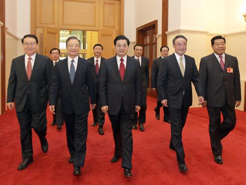 Top Communist Party of China (CPC) and state leaders Hu Jintao (C, Front), Wu Bangguo (2nd R, Front), Wen Jiabao (2nd L, Front), Jia Qinglin (1st R, Front), Li Changchun (1st L, Front), Xi Jinping (2nd L, Back), Li Keqiang (2nd R, Back), He Guoqiang (1st L, Back) and Zhou Yongkang (1st R, Back) walk to attend the opening meeting of the Third Session of the 11th National Committee of the Chinese People's Political Consultative Conference (CPPCC) at the Great Hall of the People in Beijing, capital of China, March 3, 2010.(Xinhua)