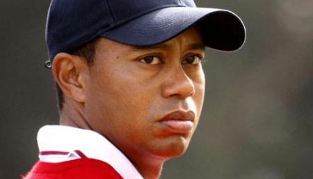 U.S. team member Tiger Woods watches play as he stands on the sixth hole during his foursome match at the Presidents Cup golf tournament at Harding Park golf course in San Francisco, California, in this October 8, 2009 file photo. (Xinhua/Reuters File Photo)