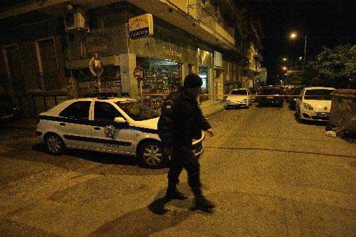 Police cordon off the explosion site in central Athens, capital of Greece, March 28, 2010. (Xinhua/Marios Lolos)