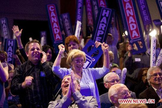Supporters of Canada's Conservative Party Leader and Prime Minister Stephen Harper react to results projecting a Conservative majority government in Calgary, Alberta, Canada, on May 2, 2011. Canada's Conservative Party led by Prime Minister Stephen Harper won the 41st federal election and will form its first majority government, according to the latest projections of the country's leading television networks. (Xinhua/Christopher Pike)