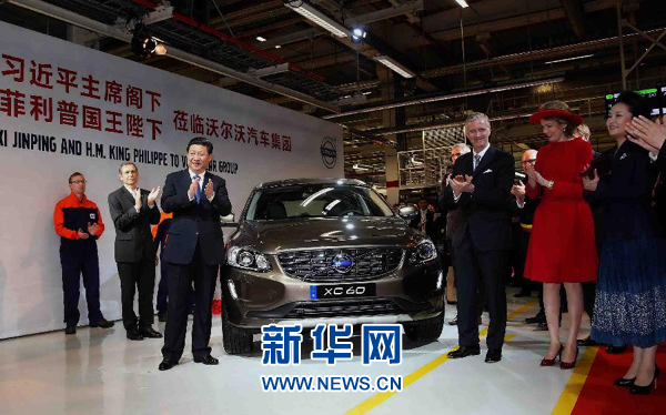 这是习近平和菲利普国王共同为公司出口中国的第30万辆汽车揭幕。新华社记者姚大伟摄