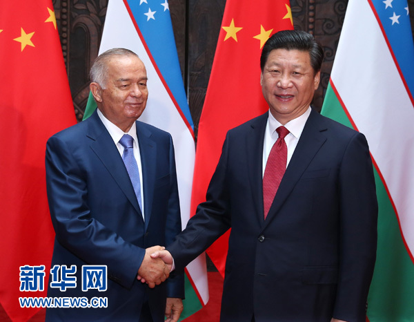 5月20日，国家主席习近平在上海会见乌兹别克斯坦总统卡里莫夫。 新华社记者 庞兴雷 摄