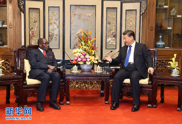 1月9日，国家主席习近平在北京钓鱼台国宾馆会见津巴布韦总统穆加贝。