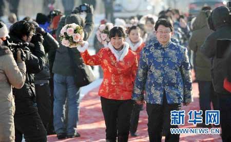 their wedding ceremonies at the Harbin Ice and Snow Festival in northeast