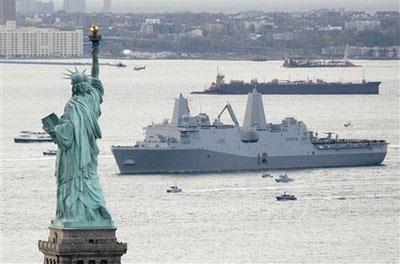 The new Navy assault ship USS New York, built with World Trade Center steel, passes Statue of Liberty as it arrives Monday, Nov. 2, 2009 in New York.(AP Photo/Mark Lennihan)