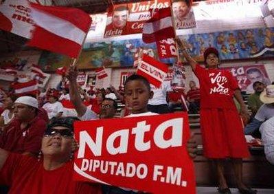 A child of a supporter of the Liberal Party holds a banner that reads "Nata deputy" during a rally marking the close of the election campaign of presidential candidate Elvin Santos in Tegucigalpa November 22, 2009. The presidential elections will be held on November 29, 2009.REUTERS/Edgard Garrido