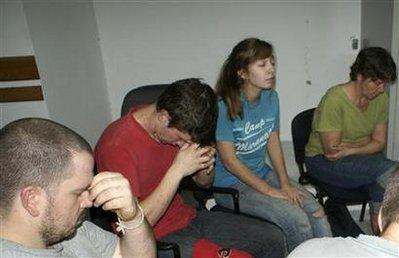 U.S. American missionaries, accused of illegally trying to take children out of Haiti, pray before hearing the verdict from Haitian Deputy Prosecutor Jean Ferge Joseph of the Judicial Police office in Port-au-Prince February 4, 2010. REUTERS/Joseph Guyler Delva 