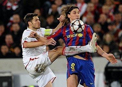 Stuttgart's Matthieu Delpierre (left) vies for the ball with Barcelona's Zlatan Ibrahimovic during their UEFA Champions League round of 16 first leg match in the southern German city of Stuttgart. The match ended in a 1-1 draw. (AFP/DDP/Torsten Silz) 