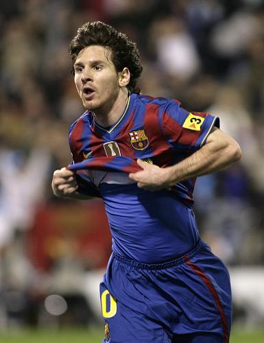 Barcelona's Lionel Messi celebrates his second goal against Zaragoza during their Spanish first division soccer match at La Romadera stadium in Zaragoza. March 21, 2010.(Xinhua/Reuters)