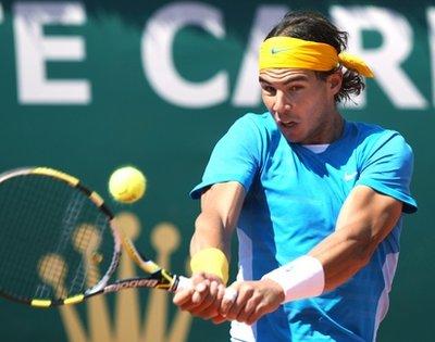 Spain's Rafael Nadal returns the balls to Netherland's Thiemo De Bakker, during their second round match of the Monte Carlo Tennis Masters tournament, in Monaco, Wednesday, April 14, 2010.(AP Photo/Claude Paris)