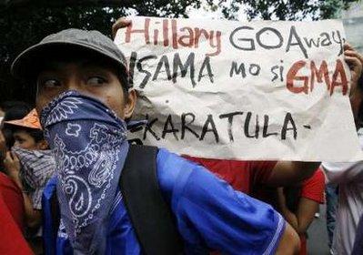 A&nbsp;protester&nbsp;displays&nbsp;a&nbsp;placard&nbsp;denouncing&nbsp;the&nbsp;upcoming&nbsp;visit&nbsp;of&nbsp;U.S.&nbsp;Secretary&nbsp;of&nbsp;State&nbsp;Hillary&nbsp;Clinton,&nbsp;during&nbsp;a&nbsp;demonstration&nbsp;in&nbsp;front&nbsp;of&nbsp;the&nbsp;U.S.&nbsp;embassy&nbsp;in&nbsp;Manila&nbsp;November&nbsp;11,&nbsp;2009.&nbsp;Clinton&nbsp;will&nbsp;visit&nbsp;the&nbsp;Philippines&nbsp;on&nbsp;November&nbsp;12-13,&nbsp;before&nbsp;the&nbsp;Asian&nbsp;Pacific&nbsp;Economic&nbsp;Cooperation&nbsp;(APEC)&nbsp;Summit&nbsp;in&nbsp;Singapore.&nbsp;The&nbsp;words&nbsp;read:&nbsp;"Hillary&nbsp;Go&nbsp;Away,&nbsp;Take&nbsp;Along&nbsp;GMA&nbsp;(Gloria&nbsp;Macapagal&nbsp;Arroyo)".REUTERS/Romeo&nbsp;Ranoco&nbsp;