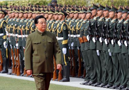 Chinese President Hu Jintao, also general secretary of the Central Committee of the Communist Party of China (CPC) and chairman of the Central Military Commission, reviews the People's Liberation Army Garrison in Macao Special Administrative Region (SAR)on Dec. 20, 2009.(Xinhua/Song Zhenping)