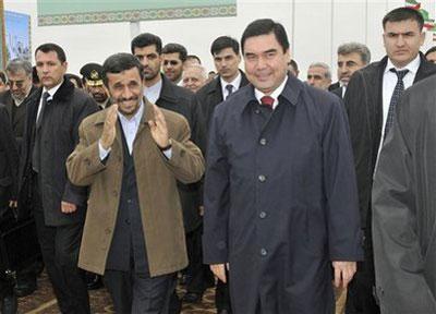 Turkmenistan's President Gurbanguli Berdymukhamedov, right, and his Iranian counterpart Mahmoud Ahmadinejad, left, seen during the inauguration ceremony for a new natural gas pipeline at its gauging station in the southeastern Sarahs district near the Iranian border, Turkmenistan, Wednesday, Jan. 6, 2010. (AP Photo)