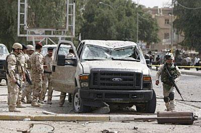 Iraqi security forces inspect the damage outside the Iranian embassy in central Baghdad, following a massive explosion. (AFP/Ahmad al-Rubaye)