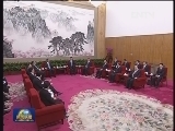 习近平会见梁振英、崔世安