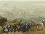 默克尔呼吁欧盟制定共同方案解决难民问题