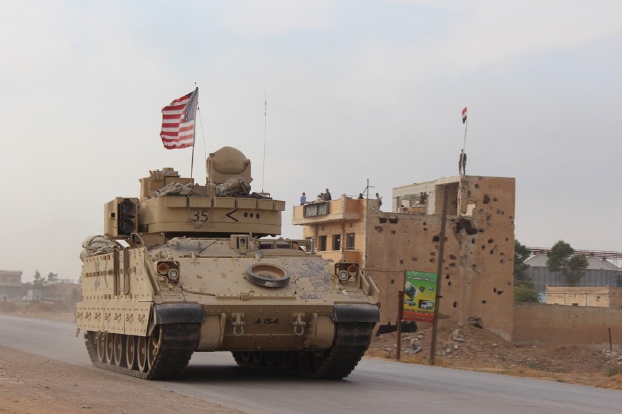 A U.S. military vehicle runs past the Tal Tamr area in the countryside of Hasakah province, northeastern Syria, Nov. 14, 2019. (Str/Xinhua)
