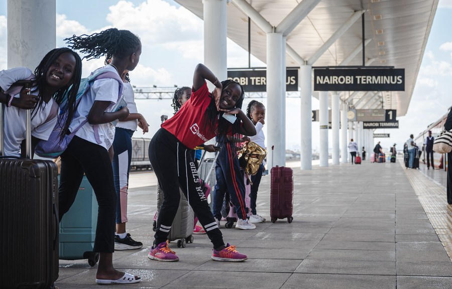 Children wait to board a train at the Nairobi Station of the Mombasa-Nairobi Railway in Nairobi, Kenya, Oct. 6, 2023. (Xinhua/Wang Guansen)