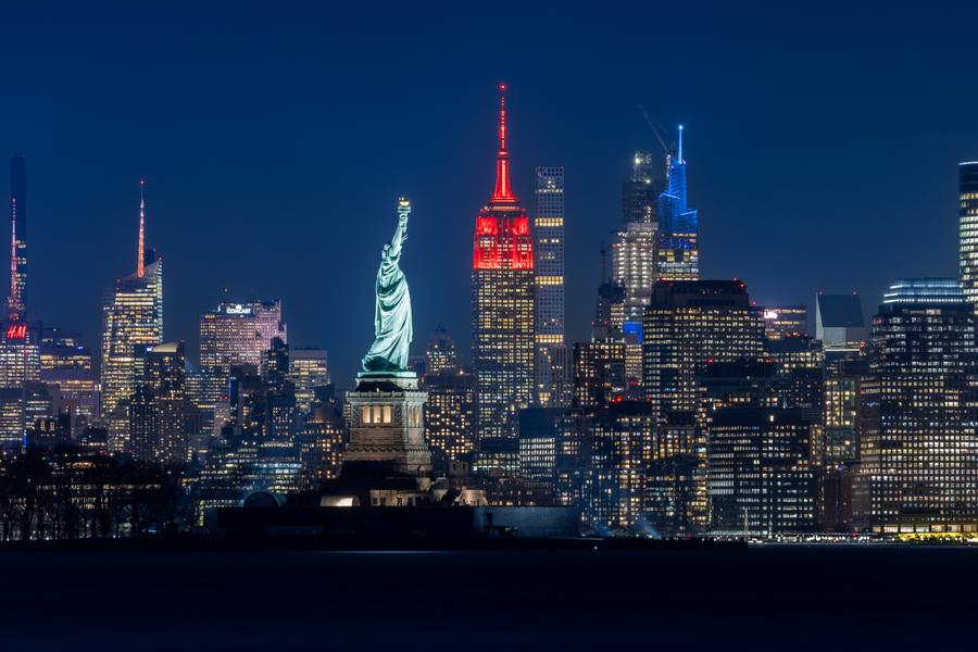 This photo taken on Feb. 8, 2024 shows the Empire State Building lit up in red for the Chinese Lunar New Year in New York, the United States. (Photo by Winston Zhou/Xinhua)