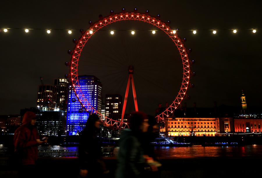 The London Eye is lit up in red to celebrate the upcoming Chinese New Year in London, Britain, on Feb. 8, 2024. (Xinhua/Li Ying)