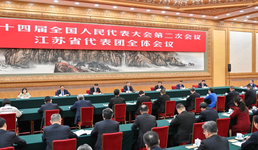 Chinese President Xi Jinping, also general secretary of the Communist Party of China Central Committee and chairman of the Central Military Commission, takes part in a deliberation with his fellow deputies from the delegation of Jiangsu Province at the second session of the 14th National People’s Congress (NPC) in Beijing, capital of China, March 5, 2024. (Xinhua/Yue Yuewei)