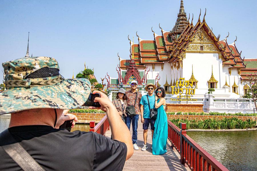 Chinese tourists pose for a group photo at Ancient Siam in Samut Prakan, Thailand, March 1, 2024. In late January, China and Thailand signed an agreement on mutual visa exemption and to be effective on March 1. (Xinhua/Wang Teng)