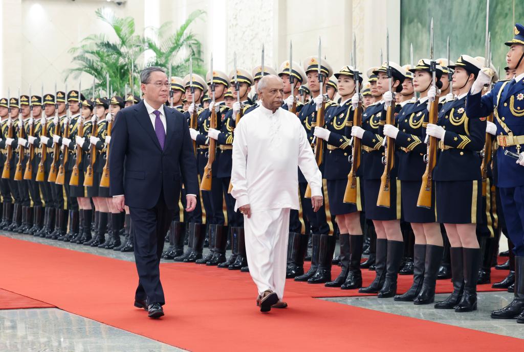 Chinese Premier Li Qiang holds a welcome ceremony for Sri Lankan Prime Minister Dinesh Gunawardena in the Northern Hall of the Great Hall of the People prior to their talks in Beijing, capital of China, March 26, 2024. Li held talks with Gunawardena, who is on an official visit to China, in Beijing on Tuesday. (Xinhua/Yao Dawei)