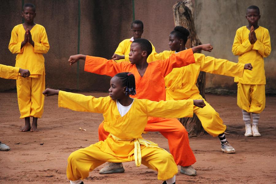 Students practice martial arts at Damien Agossou Degbo
