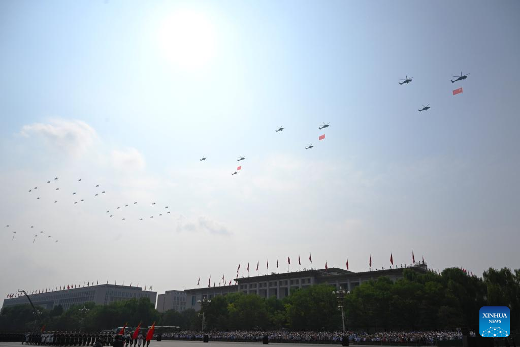 The flag-guarding air echelon flies over Tian
